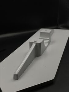 Pipe clamp with pre-cast web on the back of the shield